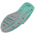 A shoe's sole is displayed featuring a textured gray base and a mint green accent design with grooves and raised sections indicating grip and traction for athletic use.