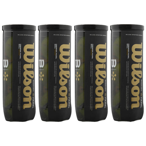 Four cylindrical black canisters labeled Wilson contain padel balls arranged side by side against a plain background showcasing branding and product details prominently on each canister.