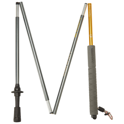 Three trekking poles are displayed in a row with varying lengths and colors including gray and orange they're designed for outdoor hiking and are found in a product showcase setting