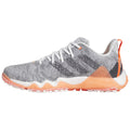 A gray athletic shoe features a textured upper with white laces and orange accents The shoe is positioned sideways showcasing its design and sole on a plain white background