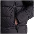 A puffy black jacket with a partially zipped front shows a hand tucked into a side pocket while the other rests against the fabric in a casual stance.