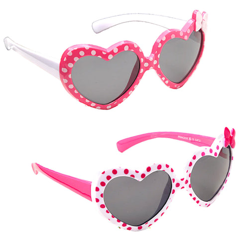 Two pairs of heart-shaped sunglasses are displayed. One pair is pink with white polka dots, while the other is white with pink polka dots and a small bow.