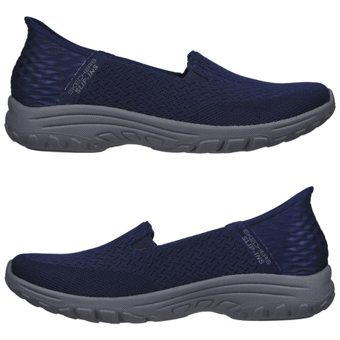 A pair of navy slip-on shoes is displayed side by side showcasing a textured upper and a gray outsole designed for comfort and ease of wear in casual settings.