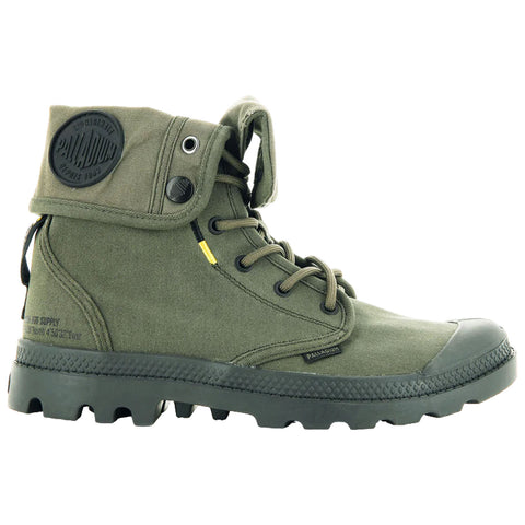 A green high-top boot sits upright featuring a detachable collar and laces while the textured rubber sole indicates suitability for rugged terrains showcasing a blend of style and functionality.