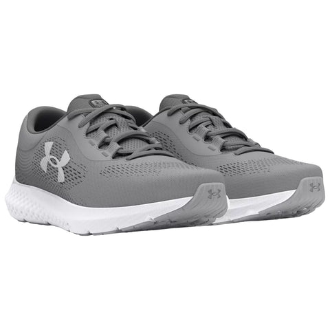 Gray athletic shoes are displayed at an angle showcasing their breathable mesh upper and cushioned sole ideal for running or training on various surfaces in a neutral setting