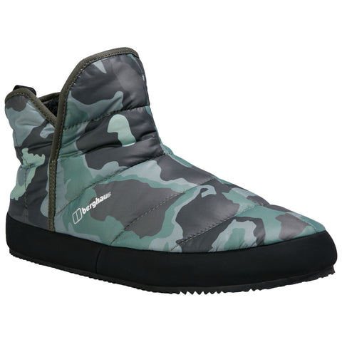 A camouflage patterned slipper is displayed sitting on a flat surface showcasing its soft padded exterior and black rubber sole designed for indoor comfort and warmth.