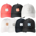 A collection of eight hats arranged in two rows features various colors including coral black white and navy each with a prominent four-leaf clover emblem on the front.