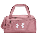 A pink duffel bag features two handles and a shoulder strap showcasing a large white Under Armour logo along with smaller zippered pockets for storage usage in sports or travel settings.