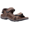 A brown sandal with adjustable straps rests on a flat surface showcasing a rugged design and cushioned footbed emphasizing comfort and support in outdoor activities.