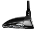 A golf club driver is angled upward showcasing its sleek black head and a textured surface with a shiny finish it stands out against a plain background.