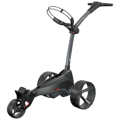 A golf trolley with three wheels is designed for transporting golf clubs. It features a handle for maneuvering, set on a sleek frame, typically found on golf courses.