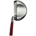 A silver putter with a distinctive rounded head and grooves on the face is positioned horizontally with a red grip visible in the foreground against a plain background