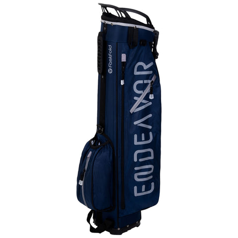 A blue golf bag stands upright showcasing multiple zippered pockets for storage. Its design includes a logo on the side and a smaller attached accessory bag for convenience.