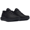 Black athletic shoes are displayed side by side. They feature a breathable textured upper with laces and a cushioned sole suitable for sports and casual wear in an indoor setting.