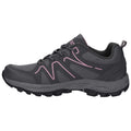 A gray athletic shoe with pink accents sits sideways displaying its textured surface and rubber sole designed for traction in outdoor conditions. It features laces and a padded collar for comfort.