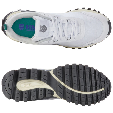 A white athletic shoe with a textured sole is displayed from a top-down view showing the laces and inner footbed featuring the brand K-Swiss logo and blue padding.