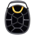 A cylindrical storage container with a textured black outer surface and a yellow handle is positioned upside down. It features a honeycomb internal structure to organize items.