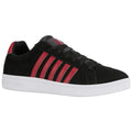 A black sneaker with red stripes sits on a flat surface showcasing its rounded toe and rubber sole designed for casual wear and athletic activities