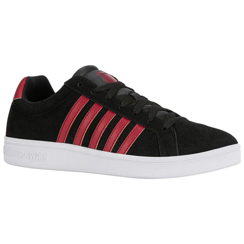 A black sneaker with red stripes sits on a flat surface showcasing its rounded toe and rubber sole designed for casual wear and athletic activities