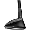 A black golf club head is shown angled sideways revealing its sleek design and logo while being positioned against a plain white background highlighting its curvature and polished surface.