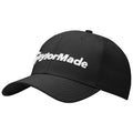 A black cap is positioned with the brim facing forward displaying the embroidered word TaylorMade in white against the textured fabric creating a sporty appearance suitable for outdoor activities.