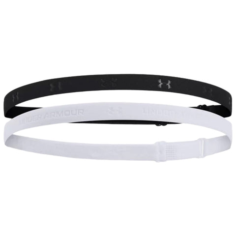 Two athletic headbands are displayed one black and one white placed horizontally with the black band slightly above the white band showcasing the brand Under Armor on both elements.