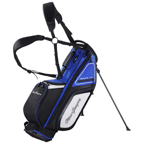 A blue and black golf bag with multiple pockets and adjustable straps stands upright on a retractable stand ready for use on a golf course setting.