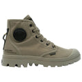 A khaki high-top boot stands upright featuring a round logo patch and laces with a rugged sole designed for outdoor use ideal for various terrains.