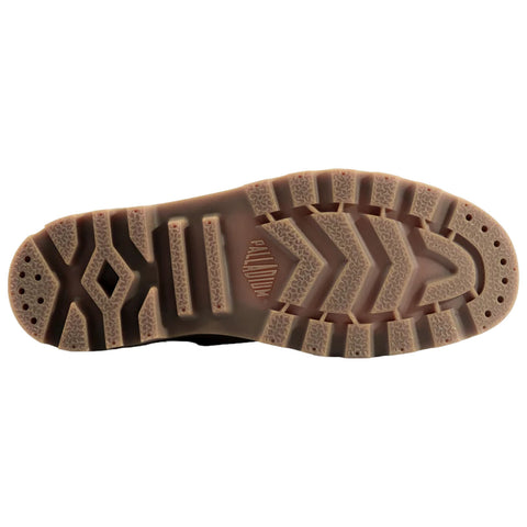 A flat shoe sole features a textured, patterned design with multiple grooves and grips for traction showcasing a light brown rubber color with the brand name PALLADIUM embossed.