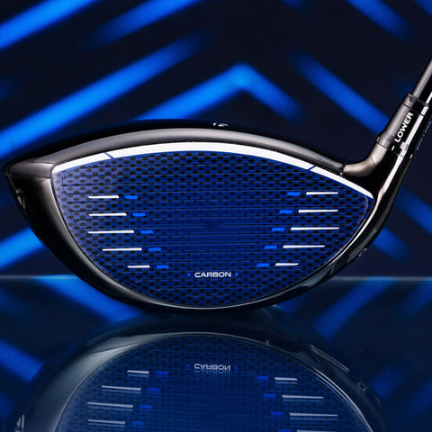 A golf club head is displayed prominently showing a sleek black and blue design with a perforated face and a glossy finish reflecting light against a geometric blue background.