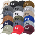 A variety of caps are displayed featuring the Under Armour logo in different colors and styles arranged in a grid pattern on a neutral background.