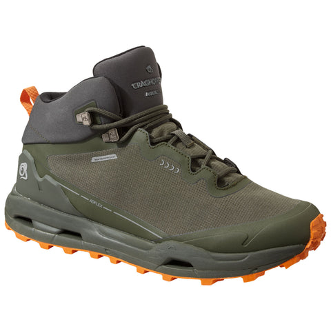 A green hiking boot stands upright with a rubber outsole and orange accents demonstrating a rugged design suited for outdoor activities equipped with waterproof features making it ideal for harsh conditions.