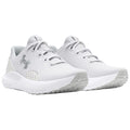 Light gray athletic shoes display a breathable mesh upper with lace fastening and a cushioned white sole positioned on a flat surface against a neutral background.