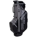 A golf bag stands upright featuring a combination of green and gray materials. It has multiple pockets and carrying straps, designed for easy transport and equipment storage. The bag displays the text "CHALLENGER ULTRA DRY" prominently.