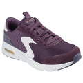 A purple sneaker featuring mesh and suede materials is positioned at an angle displaying laces and cushioning detail in a neutral, uncluttered background emphasizing the shoe's design.