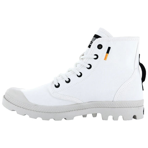 A white high-top shoe features a canvas upper and rubber sole with a textured grip showing black eyelets and a pull tab on the back in a simple studio setting.