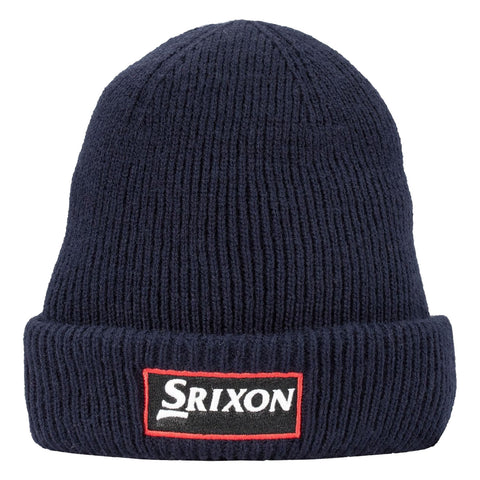 A navy beanie is displayed upright showcasing its ribbed texture and fold-over brim featuring a rectangular logo patch with the word Srixon in white and red against a black background.