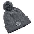 A gray knitted beanie with a pom-pom on top features a folded brim displaying a round Under Armour logo in a sporty style suitable for cold weather.