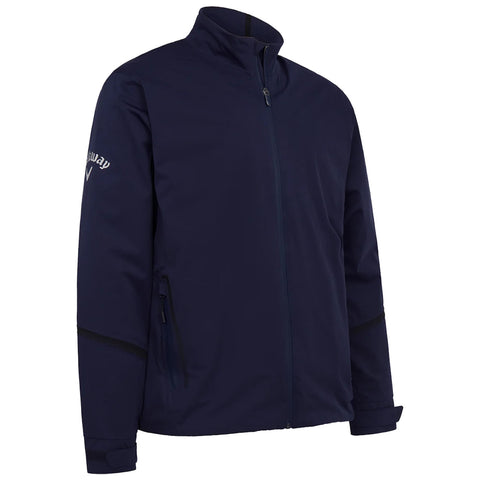 A navy jacket with a high collar and a front zipper features two side pockets and a branded logo on the left sleeve, designed for casual or outdoor wear.