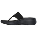 Black flip-flop sandal features a textured strap with a wide band and a cushioned heel. It is designed for casual wear, suitable for summer or indoor relaxation.