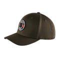 A green cap features a circular patch with a black clover and red accents resting on a flat surface illustrating a simple accessory suitable for casual wear.