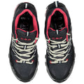 Black and pink sports shoes are positioned upright with a textured surface laced with white and red straps highlighting their design elements and brand logo visible on the side