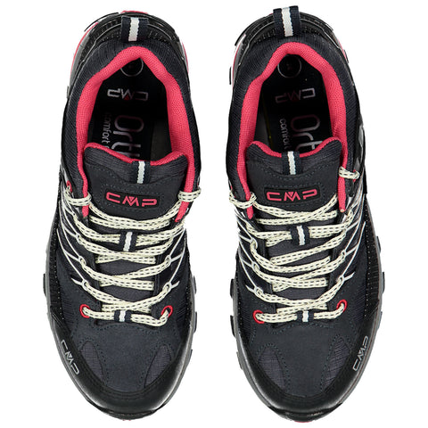 Black and pink sports shoes are positioned upright with a textured surface laced with white and red straps highlighting their design elements and brand logo visible on the side