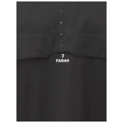 A black garment featuring a small logo and the word FARAH prominently displayed beneath it highlights simple design in a sleek and minimalistic context.