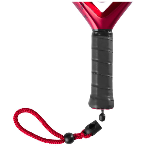 A red and black paddle is shown with a textured handle and a red wrist strap attached, designed for use in water sports or activities on a plain background.