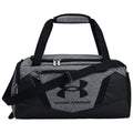 A gray and black duffel bag features two top handles and a detachable shoulder strap while displaying the Under Armour logo the bag is designed for sports or travel use.