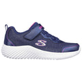 Blue athletic shoe with a velcro strap and laces sits on a white background featuring a textured sole designed for comfort and movement suitable for active wearers.