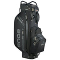 A black golf bag stands upright featuring multiple zippered compartments and branded details showcasing its waterproof design in a sleek modern style suitable for golf enthusiasts.