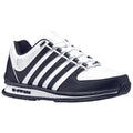 A black and white athletic shoe sits on a flat surface featuring a sleek design with multiple black stripes a textured black toe and laces providing a sporty appearance.