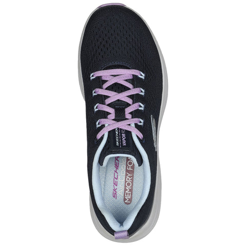 A black athletic shoe with a mesh upper features purple laces and a soft insole labeled Memory Foam designed for comfort and support placed against a plain background.